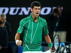 Serbia's Novak Djokovic celebrates winning the Australian Open men's singles title against Austria's Dominic Thiem on Feb. 2, 2020.