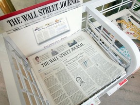 The Wall Street Journal newspaper is offered for sale alongside other papers at a newsstand in the Chicago Board of Trade building July 17, 2007 in Chicago, Illinois.