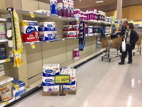 Toilet paper shelves are nearly barren at a grocery store on March 3, 2020.