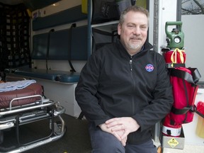 Troy Clifford, president of the Ambulance Paramedics of B.C., sits in an ambulance outside the union's Richmond offices on March 25.