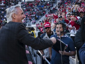 XFL Commissioner Oliver Luck interacts with fans while contributing to the beer cup snake during the second half of the XFL game between the DC Defenders and the St. Louis Battlehawks at Audi Field in Washington, D.C. on March 8, 2020.