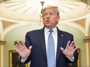 U.S. President Donald Trump talks to reporters at the Capitol after attending the Senate Republicans weekly policy luncheon on March 10, 2020 in Washington, DC.