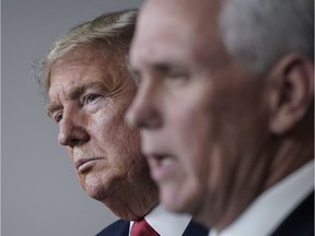 WASHINGTON, DC - MARCH 24: (L-R) U.S. President Donald Trump and Vice President Mike Pence attend a briefing on the coronavirus pandemic, in the press briefing room of the White House on March 24, 2020 in Washington, DC.