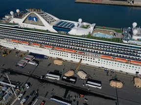 Passengers disembark from the Princess Cruises Grand Princess cruise as it sits docked in the Port of Oakland on March 10, 2020 in Oakland. (Photo by Justin Sullivan/Getty Images)
