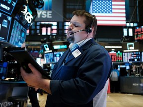 Traders work on the floor of the New York Stock Exchange on March 16, 2020 in New York City.