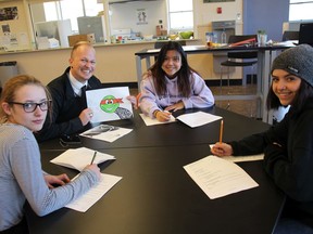 Brett Hancock, principal of the alternative school program in Nanaimo-Ladysmith school district, shown here with some of his students in the old Woodlands Secondary needs help from Adopt A School to buy food and clothes.