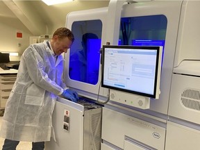A pair of automated testing machines at St. Paul's Hospital, pictured, typically used for HIV and hepatitis B, have been successfully repurposed to analyze COVID-19 testing swabs.