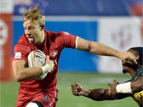 Canada’s Harry Jones fends off a tackler during a game against South Africa at the USA Sevens Rugby tournament in Las Vegas in 2018. ‘It’s best to sit back and wait this storm out, see what comes with it,’ Jones says of not going to the Tokyo Summer Games and seeing where the world is at in light of the COVID-19 coronavirus pandemic.
