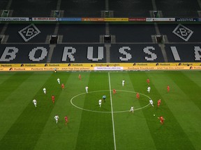 An overview shows the empty stadium during the German first division Bundesliga football match Borussia Moenchengladbach v 1 FC Cologne in Moenchengladbach, western Germany on March 11, 2020. - Rhine Bundesliga derby between Borussia Moenchengladbach and Cologne, will be held behind closed doors due to the coronavirus, the first game in Bundesliga history to be played without fans.