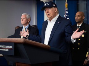 US President Donald Trump speaks during a press briefing about the Coronavirus (COVID-19) alongside US Vice President Mike Pence (L) and members of the Coronavirus Task Force in the Brady Press Briefing Room at the White House in Washington, DC, March 14, 2020. - President Donald Trump says he has taken coronavirus test, no result yet. (Photo by JIM WATSON / AFP)