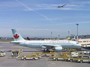 In this file photo, an Air Canada plane sits on the tarmac at Trudeau airport near Montreal.