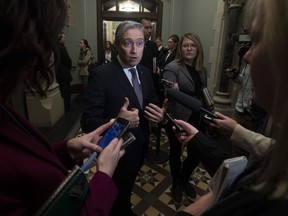 Foreign Affairs Minister Francois-Philippe Champagne speaks with the media following caucus on Parliament Hill in Ottawa, Wednesday March 11, 2020.