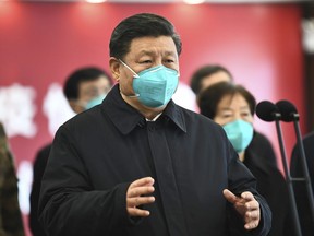 China's President Xi Jinping talks by video with patients and medical workers at the Huoshenshan Hospital in Wuhan in central China's Hubei Province, on March 10, 2020.