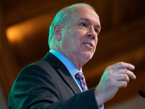 B.C. Premier John Horgan speaks about the economy during an address at a Surrey Board of Trade luncheon, in Surrey, B.C., on Tuesday, March 10, 2020.