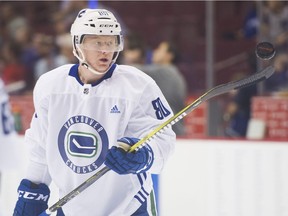 Canucks Prospect Jack Rathbone bounces a puck off his stick at Rogers Arena in July, 2018.