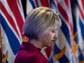 Provincial health officer Dr. Bonnie Henry listens during a news conference about the provincial response to the coronavirus in March, 2020.