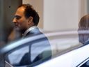 David Sidoo, of Vancouver, enters an adjacent building with his lawyer following a federal court hearing Friday, March 15, 2019, in Boston. Sidoo faced charges of conspiracy to commit mail and wire fraud as part of a wide-ranging college admissions bribery scandal.