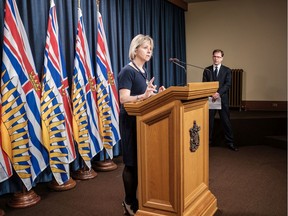 B.C. Health Minister Adrian Dix, right, listens to Chief Provincial Health Officer Dr. Bonnie Henry discuss medical supplies and how the novel coronavirus pandemic has caused stress on the supply chain.