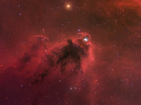 This image obtained by NASA on February 21, 2020 shows Lynds' Dark Nebula (LDN) 1622 that appears against a faint background of glowing hydrogen gas only visible in long telescopic exposures of the region. In contrast, the brighter reflection nebula vdB 62 is more easily seen, just above and right of center.