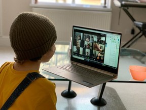 A school kid socializes with peers online following school closures due the spread of the coronavirus disease.