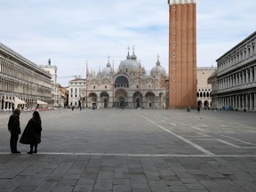 An almost empty St. Mark's Square in Venice on March 9, 2020, in the wake of the Italian government imposing a virtual lockdown on the north of Italy in order to try to contain a coronavirus outbreak.