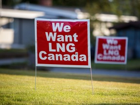 Signs reading "We Want LNG Canada" stand on a lawn in the residential area of Kitimat, British Columbia, in 2016.