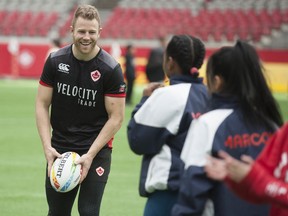 Conor Trainor of Vancouver, a member of the Canadian squad playing in this weekend's Rugby Sevens tournament in Vancouver, takes part in a meet-and-greet event on Wednesday at B.C. Place Stadium.