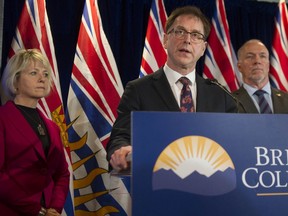 Health Minister Adrian Dix with the provincial health officer, Bonnie Henry.