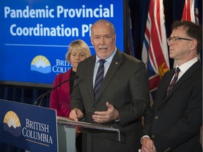 B.C. Premier John Horgan, with Health Minister Adrian Dix, right, and Provincial Health Officer Bonnie Henry.