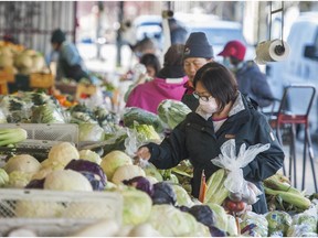 Shoppers at Sunrise Market on Powell Street in Vancouver. B.C. residents will soon be able to shop at their local farmers market online during the pandemic.