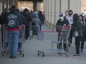 Shoppers at Costco in Burnaby, line-up to be allowed into the store.