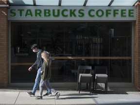 A closed Starbucks on Howe Street in Vancouver on March 20. Due to the COVID-19 outbreak, people must keep their distance from each other to control the spread of the virus.