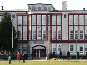 Children playing at Templeton Secondary School on March 17 in Vancouver as the B.C. government announces schools from Kindergarten to Grade 12 will close until further notice in a bid to halt the spread of the coronavirus.