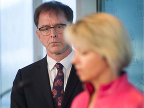 Adrian Dix, B.C.'s minister of health, and Dr. Bonnie Henry, provincial health officer, give an update on the COVID-19 pandemic at the premier's office in Vancouver on March 18.