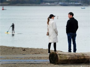 Beachgoers at English Bay as health officials have recommended strict social distancing to prevent the spread of COVID-19 in Metro Vancouver.