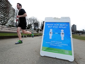 Joggers on the seawall as health officials have recommended strict social distancing to prevent the spread of COVID-19 in Metro Vancouver.