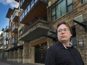 Tommy Thomson stands in front of his rental building in Burnaby, BC, March 24, 2020.