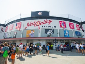 People stand outside before a Vancouver Canadians game.