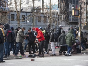 Vulnerable Downtown Eastside residents continued to clump together on East Hastings Street this week. Self-distancing can be difficult for many reasons in this community, sparking fears of rampant spread of COVID-19.