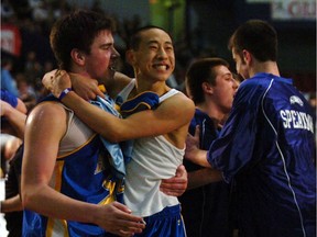 Handsworth Royals Don Lee, centre, and Cole Allinger celebrate their win in 2006 over the Kitsilano Blue Demons in the B.C. high school boys' AAA basketball final at the PNE Agrodome in Vancouver.