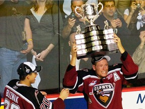 Former Vancouver Giant J.D. Watt hoists the Memorial Cup after his WHL team beat the Medicine Hat Tigers 3-1 in the 2007 Memorial Cup Final at the PNE Coliseum in Vancouver.