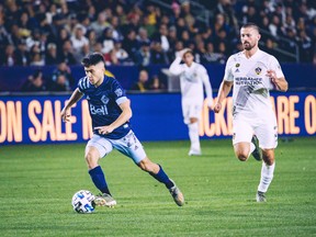 Ryan Raposo races upfield in front of L.A. Galaxy defender Giancarlo González during his professional debut with the Vancouver Whitecaps on Saturday. Raposo earned an assist in the 1-0 win.
