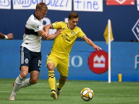 Andy Rose, left, will start at centreback for the Vancouver Whitecaps Saturday night against the L.A. Galaxy, a move coach Marc Dos Santos says is about experience and leadership ability.