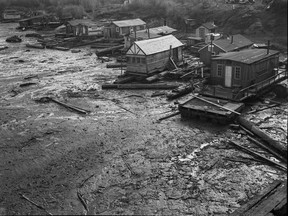 Squatters' shacks in False Creek in 1949. John McGinnis took this photo for a story on murderer Frederick Ducharme, who lived in one of the shacks. The location was on the south side of False Creek, near the Burrard Bridge and the old Kitsilano Trestle.