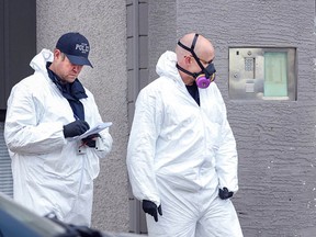 Police gathering evidence at the scene of a fatal stabbing spree late Saturday, March 28, in a Kamloops apartment.