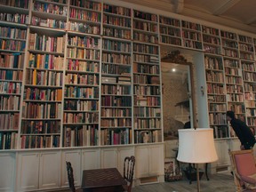 Rare books dealer Adam Weinberger on the hunt at a personal library in Manhattan.