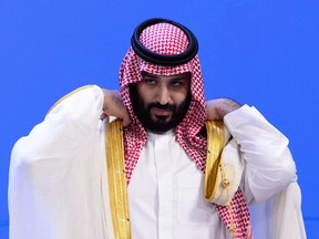 Crown Prince of Saudi Arabia Mohammed Bin Salman waits for fellow leaders to take part in the family photo at the G20 Summit in Buenos Aires, Argentina on Friday, Nov. 30, 2018.