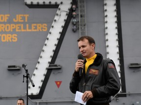 Captain Brett Crozier, commanding officer of the U.S. Navy aircraft carrier USS Theodore Roosevelt, addresses the crew during an all-hands call on the ship’s flight deck in the eastern Pacific Ocean December 19, 2019. Picture taken December 19, 2020.