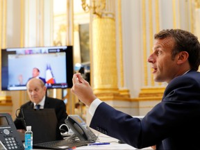 French President Emmanuel Macron speaks with Tedros Adhanom Ghebreyesus, Director General of the World Health Organization and other world leaders about the coronavirus outbreak during a video conference at the Elysee Palace in Paris, France, April 24, 2020.
