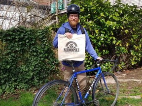 On minimum orders of $75, Audiopile will deliver records to your home in Vancouver. The store also offers contact-free pickup. Manager Mark Richardson is shown here preparing for a delivery.